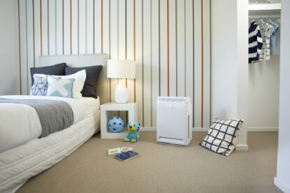 A photo of beautiful bedroom with Daikin air purifier